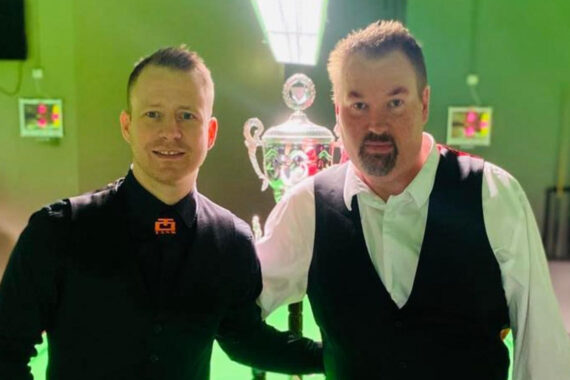 Thorri Jensson and Jóhannes B Jóhannesson pose in front of the Icelandic Snooker Championship trophy.