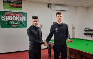 Muhammad Usama Zafar and Gianmarco Tonini shake hands.