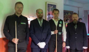 Hull and Tiihonen stand with the referees/officials.