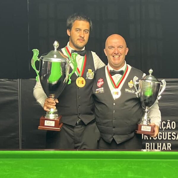 Carlos Correia and Henrique Correia pose with their trophies.
