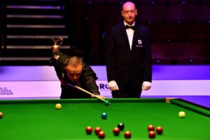 Aaron Canavan plays a shot at the Crucible Theatre during the 2020 World Seniors Snooker Championship.