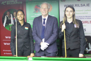 Snenthra Babu and Jamie Hunter pose for a photo either side of Aidan Murray, the referee.