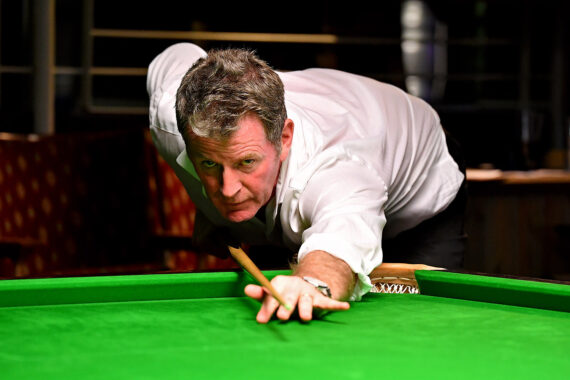 Peter Gilchrist plays a shot.