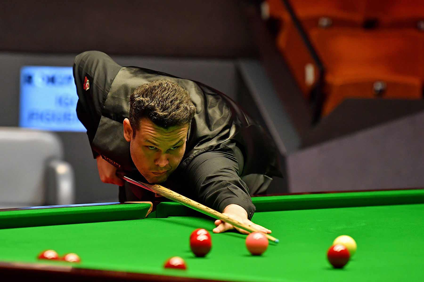 Igor Figueiredo plays a shot at the Crucible Theatre during the 2021 World Seniors Snooker Championship.