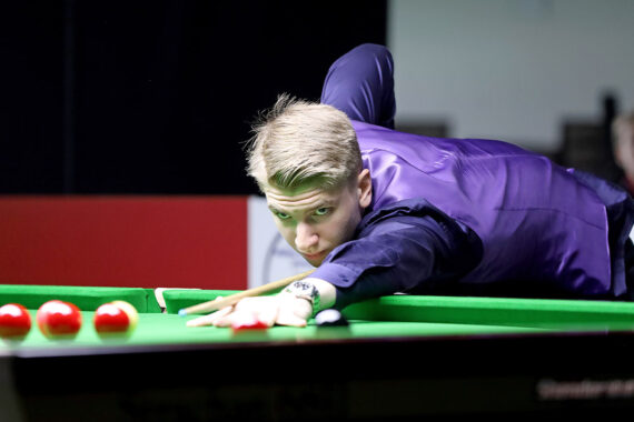 Iulian Boiko plays a shot.