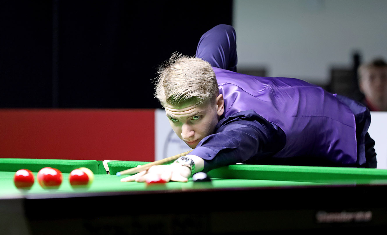 Iulian Boiko plays a shot.