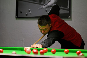 Michael Holt plays a shot.