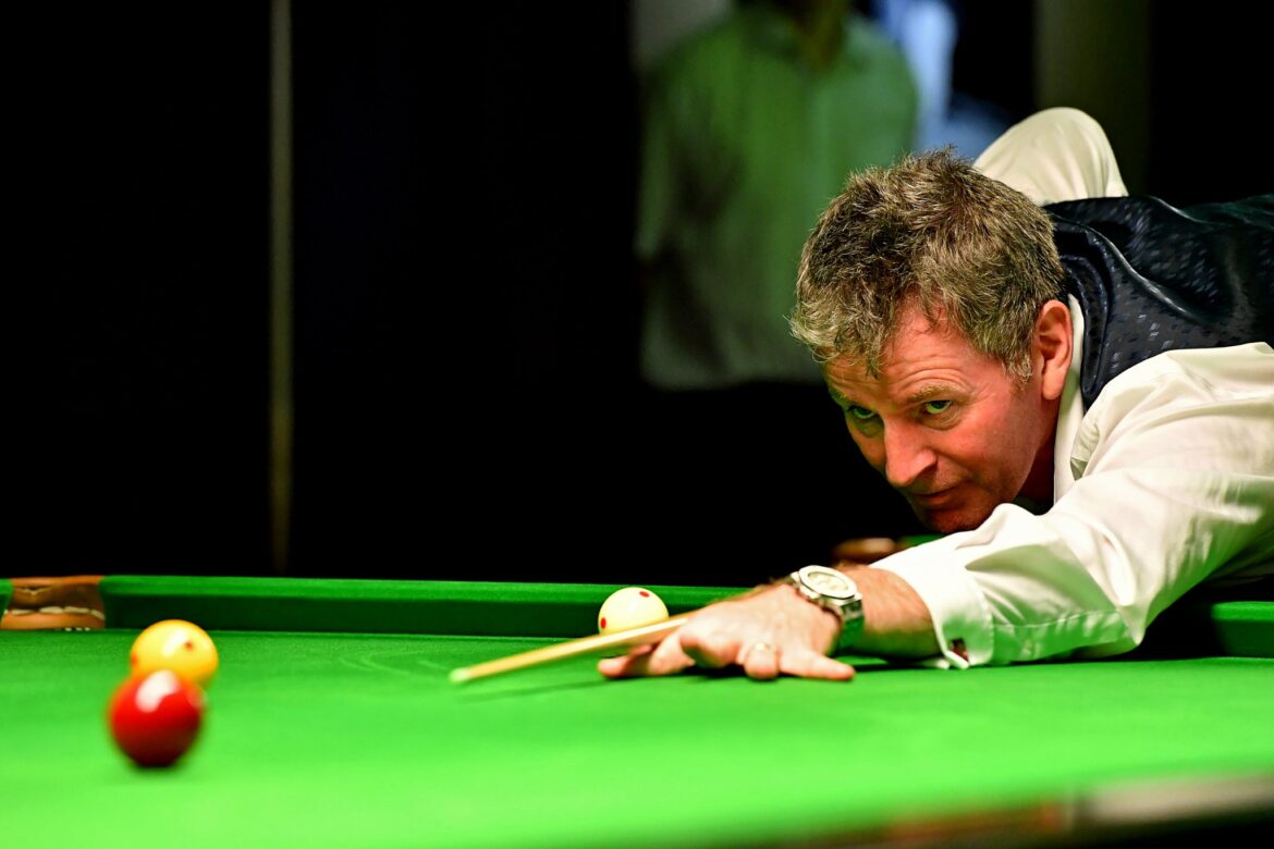 Peter Gilchrist plays a shot.