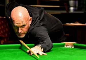 Peter Sheehan playing a shot.