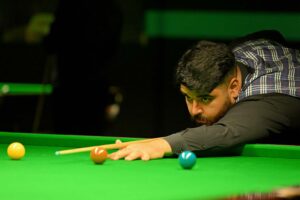 Umut Dikme plays a shot.