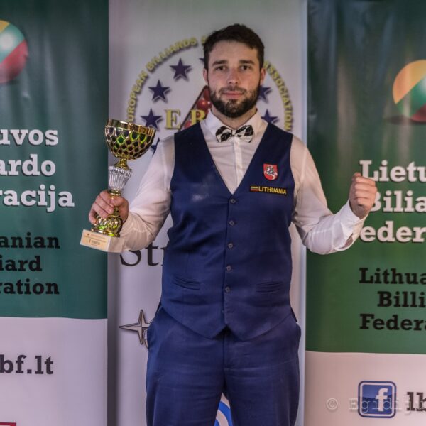Vilius Schulte-Ebbert poses with the winner's trophy.