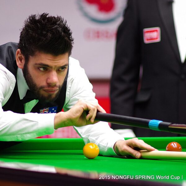 Vinnie Calabrese plays a shot with the rest in his waistcoat at the 2015 World Cup whilst representing Australia.