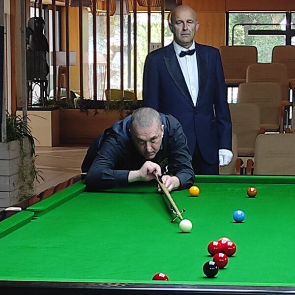 Wayne Brown plays a shot.